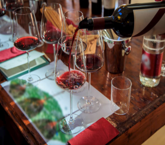 Tuscany wine tasting tour – red wines being poured